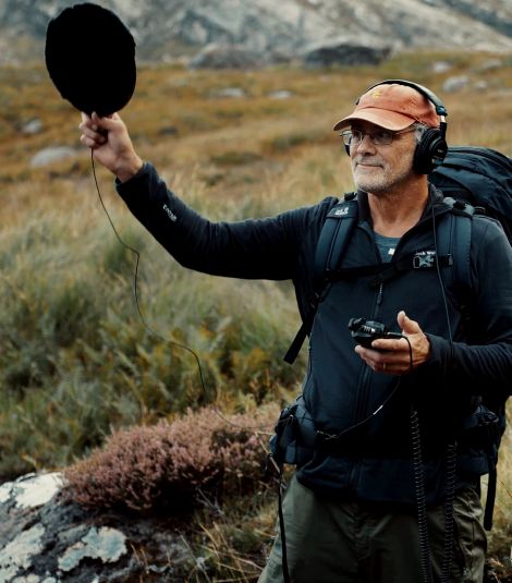 Todd holding a recording device